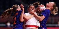 TOKYO, JAPAN - AUGUST 04: Laura Flippes of Team France is challenged by Bo van Wetering and Nycke Groot of Team Netherlands during the Women's Quarterfinal handball match between France and Netherlands on day twelve of the Tokyo 2020 Olympic Games at Yoyogi National Stadium on August 04, 2021 in Tokyo, Japan. (Photo by Dean Mouhtaropoulos/Getty Images)