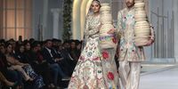 Models present creations by designer Ali Xeeshan during a fashion show organized by Hum Bridal Couture Week 2023 in Lahore, Pakistan, 17 December 2023. The Hum Bridal Couture Week runs from 15 to 17 December.  EPA-EFE/RAHAT DAR