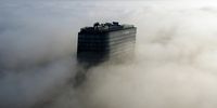 A picture taken with a drone shows morning fog covering the Hanza Tower skyscraper in Szczecin, northwestern Poland, 12 March 2024.  EPA-EFE/Marcin Bielecki POLAND OUT
