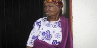 An old lady stands in the doorway of her room. High levels of socialisation in senior citizens to help increase longevity. (Photo: Shiraaz Mohamed)
