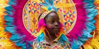 LONDON, ENGLAND - AUGUST 28: Performers process down the route during the Notting Hill carnival on August 28, 2022 in London, England. The Caribbean carnival returns to the streets of Notting Hill after a two-year hiatus due to the Covid pandemic. (Photo by Dan Kitwood/Getty Images)