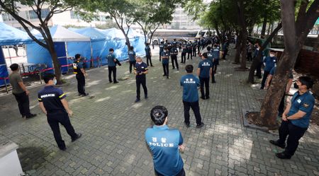 South Korea urges more testing, quarantines as coronavirus cases hit high