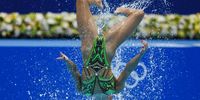 epa09388513 Charlotte Tremble and Laura Tremble of France perform in the Women's Duet Free Routine Preliminary during the Artistic Swimming events of the Tokyo 2020 Olympic Games at the Tokyo Aquatics Centre in Tokyo, Japan, 02 August 2021.  EPA-EFE/Patrick B. Kraemer