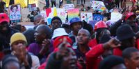 Members of the LGBTQIA+ community, students and staff protest as Professor Patrick Lumumba delivers his address at the University of Cape Town. (Photo: Ernst Calitz)