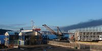 View from North Pier, Durban: smoke stream from fuel pipe fire.