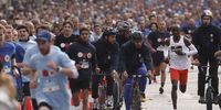 Kipchoge in action during the 'Marathon pour Tous' event (Marathon for all) as part of the Paris 2024 Olympic and Paralympic Games build-up on the Champs Elysees in Paris on 10 October, 2021. ( EPA-EFE/YOAN VALAT)