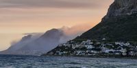 The mountains above Simonstown smoldering after the fire of 19 December 2023. Photographer: David Seligman