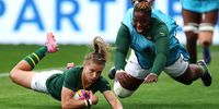 Nadine Roos of South Africa scores her team’s second try as teammate Nombuyekezo Mdliki joins the celebrations. (Photo: Stu Forster / Getty Images)