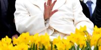 Pope Francis, sitting on a wheelchair, waves as he leaves after his weekly general audience in Saint Peter's Square, Vatican City, 03 April 2024.  EPA-EFE/ETTORE FERRARI