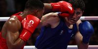 Tiago Muxanga of Mozambique (red) in action against Marco Alonso Verde Alvarez of Mexico during their Men's 71kg round of 16 bout of the Boxing competitions in the Paris 2024 Olympic Games, at the North Paris Arena in Villepinte, France, 31 July 2024.  EPA-EFE/DIVYAKANT SOLANKI