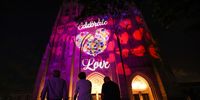 WASHINGTON, DC - JUNE 07: People look as the Washington National Cathedral is illuminated for Pride Month on June 07, 2021 in Washington, DC. The Cathedral will be lit in rainbow hues from June 6-8 in honor of Pride Month. (Photo by Kevin Dietsch/Getty Images)