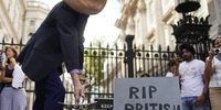 A protester depicting British Prime Minister Boris Johnson demonstrates during a protest outside the gates of Number 10 Downing Street in Westminster, London, Britain, 28 August 2019.  EPA-EFE/WILL OLIVER