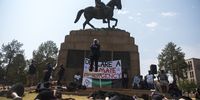 Activists from the group Stage For Change perform an act in a protest at the Louis Botha Statue at the Union Buildings Pretoria. The protest saw participation from fellow activists in Cape Town and was made up of over twenty union, civil society, grassroots and community based organisations.<br>Photo / Shiraaz Mohamed.