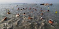 Participants during the start of the annual 42nd Cross-Balaton Swim at Revfulop, Hungary, 21 July 2024. The distance they swim to the other side of the lake is 5.2 kilometres.  EPA-EFE/Tamas Vasvari HUNGARY OUT