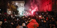 epa10352884 Moroccan supporters celebrate their team winning the FIFA World Cup 2022 round of 16 soccer match between Morocco and Spain, on the Champs Elysees avenue in Paris, France, 06 December 2022.  EPA-EFE/YOAN VALAT