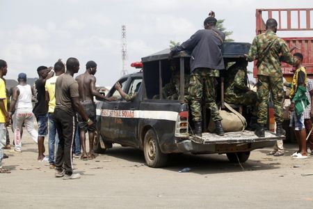 Fires burn in Lagos after Nigerian soldiers shoot anti-police protesters