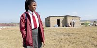 Mahobe Sukiswa, a Grade 12 pupil at Gwebityala Senior Secondary School,<br>standing in front of the small home she shares with seven family members. Photo: Max Bastard.<br>