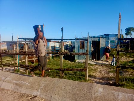 Khayelitsha youngsters eke out a living carrying water for residents