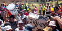 Residents of Phumla mqashi informal settlement in Lenasia South protest over their water supply. (Photo: Julia Evans)