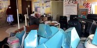 The waiting room at the Matubeni Clinic. The building lost part of its roof during a storm last year and it has never been replaced. When it rains the clinic gets flooded.<br>(Photo: Hoseya Jubase)