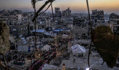 Palestinians mourn slain Hamas militant chief as Israel escalates Gaza attacks
