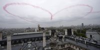 PARIS, FRANCE - JULY 26: Aircraft make a heart out of smoke during the opening ceremony of the Olympic Games Paris 2024 on July 26, 2024 in Paris, France.  (Photo by Eugene Hoshiko-Pool/Getty Images)