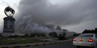 Smoke rises from the Lulu hypermarket in Sohar on 28 February 2011 after protesters allegedly set it on fire during protests calling for political reforms (Photo: EPA/Hamid Al-Qasmi)