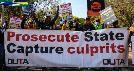 Demonstrators gather at UAE Embassy to demand the extradition of the Guptas just days after treaty signed