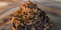 Le Mont.Saint-Michel at Sunset. "For me, this piece of art on the shores of Normandy is a candidate for Eighth Wonder of the World; providing a legendary view and atmosphere especially at sunset and when the tide is low." © Cigdem Ayyildiz, Turkey, Winner, National Awards, Landscape, 2022 Sony World Photography Awards