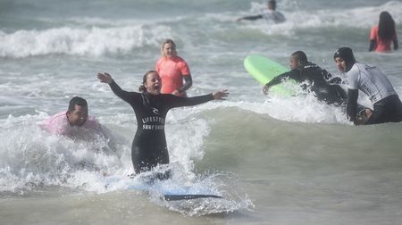 Riding a wave: Surfing spreads delight and creates awareness of those with special needs