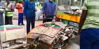Waste pickers in Mushroomville load cardboard boxes they have collected on to a buyer’s truck. (Photo: Zoë Postman)