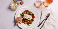 Classic caprese – wood-fired oregano and garlic heirloom cherry tomatoes and sliced whole tomatoes with fior di latte mozzarella, balsamic glaze and basil pesto. (Photo: Jenni Elizabeth)