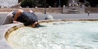 A person cools off at the Piazza del Popolo, during a heatwave across Italy, as temperatures are expected to rise further in the coming days, in Rome, Italy July 18, 2023. REUTERS/Remo Casilli     TPX IMAGES OF THE DAY