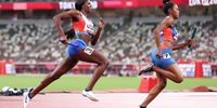 TOKYO, JAPAN - JULY 30: Taylor Manson of Team United States carries the baton while competing in the 4x400 Relay Mixed Round 1 on day seven of the Tokyo 2020 Olympic Games at Olympic Stadium on July 30, 2021 in Tokyo, Japan. (Photo by Christian Petersen/Getty Images)