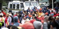 Law enforcement keep watch over a small gathering of Cosatu members who are protesting against 'unsafe' and 'unreliable' public transport in the Western Cape. (Photo: Leila Dougan)