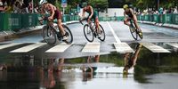 TOKYO, JAPAN - JULY 27:  Zsofia Kovacs of Team Hungary, Gillian Sanders of Team South Africa and Alexandra Razarenova of Team ROC compete during the Women's Individual Triathlon on day four of the Tokyo 2020 Olympic Games at Odaiba Marine Park on July 27, 2021 in Tokyo, Japan. (Photo by Buda Mendes/Getty Images)