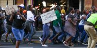 A protestor holds a sign saying "Remember Ubuntu." A collective of South Africa and regional civil society organisations march against the controversial anti-LGBTQ+ bill passed by Uganda's Parliament. 31.03.2023. Photo: Shelley Christians