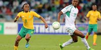Siphiwe Tshabalala of South Africa (left) and James Okwuosa of Nigeria lose the ball during the 2013 Nelson Mandela Challenge match between South Africa and Nigeria at Moses Mabhida Stadium on 14 August 2013 in Durban, South Africa. (Photo: Anesh Debiky / Gallo Images / Getty Images)
