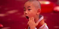 A young monk reacts after getting his hair shaved off during the 'Children becoming Buddhist monks' ceremony at the Jogyesa temple in Seoul, South Korea, 09 May 2023. The children will stay at the temple to learn about Buddhism for 21 days. South Korean Buddhists prepare to celebrate Buddha's upcoming birthday on 27 May.  EPA-EFE/JEON HEON-KYUN