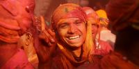 Hindu men from the villages of Nandgaon and Barsana are covered with colored powder as they celebrate the Lathmar Holi festival at the Nandgram temple in Nandgaon, Mathura, India, 19 March 2024. Holi is the Hindu spring festival of colors. In Barsana and Nandagaon, people celebrate a variation of Holi called 'Lathmar' Holi, which means beating with sticks. During the first day of the Lathmar Holi festival, the women of Barsana, the birthplace of Hindu God Krishna's beloved Radha, beat the men from Nandgaon, the hometown of Hindu God Krishna, with wooden sticks in response to their efforts to put color on them. On the second day the women of Nandgaon beat the men of Barsana.  EPA-EFE/NIKHIL SINGH