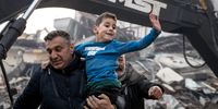Rescue workers carry 8-year-old survivor Yigit at the site of a collapsed building 52 hours after an earthquake struck on February 08, 2023 in Hatay, Turkey. A 7.8-magnitude earthquake hit near Gaziantep, Turkey early Monday, followed by another 7.5-magnitude tremor just after midday. The quakes caused widespread destruction in southern Turkey and northern Syria and were felt in nearby countries. (Photo by Burak Kara/Getty Images)