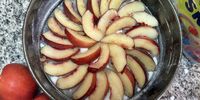 Lay out the nectarine half moons in concentric circles, on top of the sugar and butter. (Photo: Tony Jackman)<br>