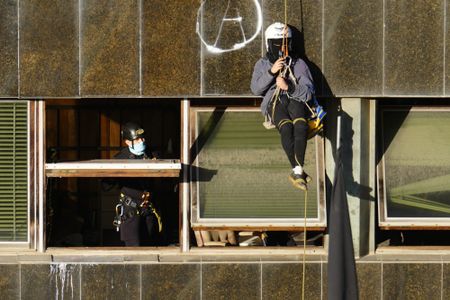 Barcelonian squatters hijack two buildings and resist police eviction, and more from around the world