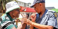 Members of Operation Dulula during a picket outside the office in Soweto where spaza shop owners were registering their businesses on 18 November 2024.  (Photo: Sharon Seretlo / Gallo Images)