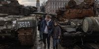 KYIV, UKRAINE - FEBRUARY 02: Children look at destroyed Russian military vehicles on display in Mykhailivskyi Square, on February 2, 2023 in downtown Kyiv, Ukraine. February 24 will mark one year since Russia's large-scale invasion of Ukraine. In the time since, fighting has largely concentrated in the east and south of the country, but the capital remains the target of regular air strikes. (Photo by Roman Pilipey/Getty Images)