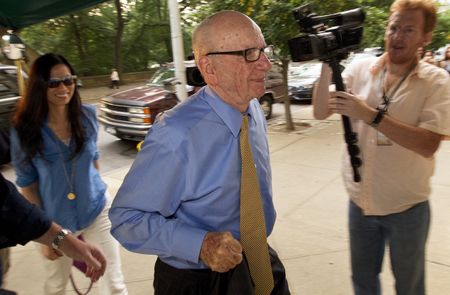 News Corp tries to settle debts, limit damage