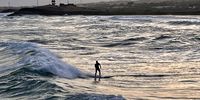 Sunset Surfing in Somalia. Photographer: Themba Linden