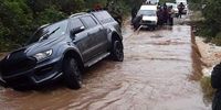 Motorists help a stuck  vehicle in Gatyana, Eastern Cape, after floods. (Photo: Supplied)