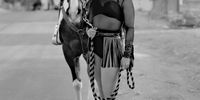 These portraits were taken just before the pandemic reached the USA in February 2020. Drag Queen Cowboys is a collaboration with the vibrant community of performers based in Las Vegas. Set in Nevada, and inspired by the locations and displacement of characters in John Houston’s film The Misfits (1961), all drag queens chose and painstakingly made their own ‘Western’ outfits; including accessories, wigs and applying their own make-up. After gaining their trust, I steered them away from their nocturnal habitat of bars and clubs. With no artificial lighting or digital technology, I shot these portraits on black-and-white film, using a plate camera, in the natural light of the American West. © Jane Hilton, United Kingdom, Finalist, Professional, Portraiture, 2021 Sony World Photography Awards