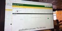 The mining applications process of the new cadastre displayed on a big screen. (Photo: Ed Stoddard)